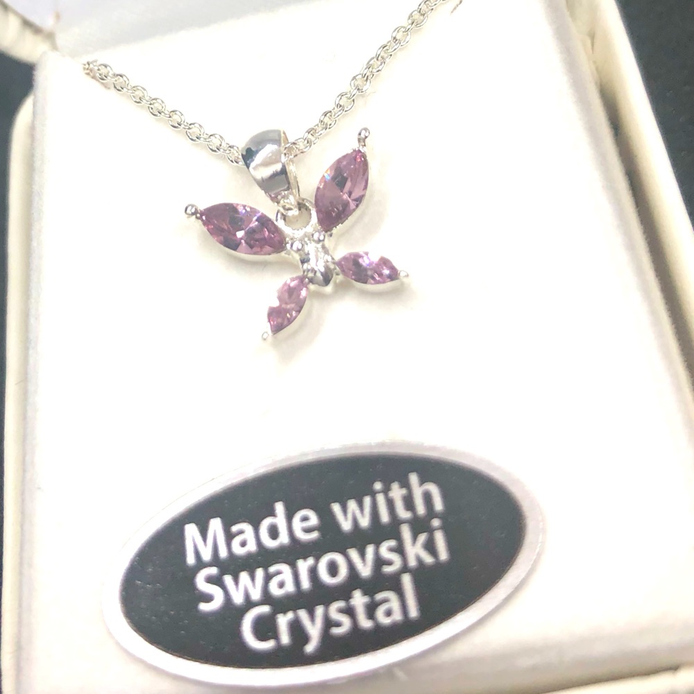 NWT rhodium plated Swarovski pink crystal necklace. I also have a blue crystal.